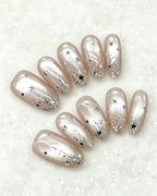 Celestial Star Press On Nails - Sheer Shimmer Nude Almond Nails with Starburst Art